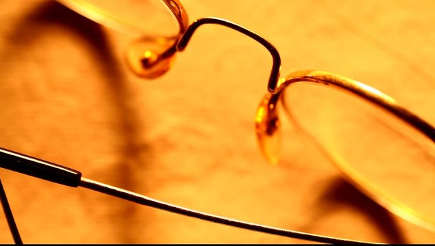Reading glasses on pape