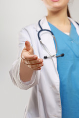 Female  doctor giving hand for handshaking