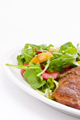 cervical chop with apricot-rocket salad