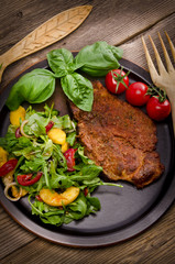 cervical chop with apricot-rocket salad