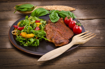 cervical chop with apricot-rocket salad