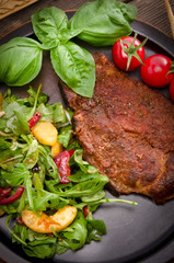 cervical chop with apricot-rocket salad