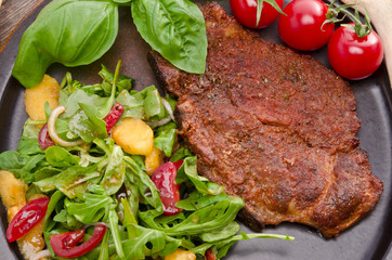 cervical chop with apricot-rocket salad