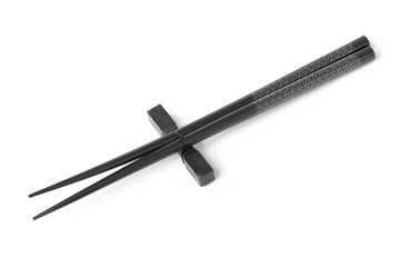 Two black chopsticks isolated