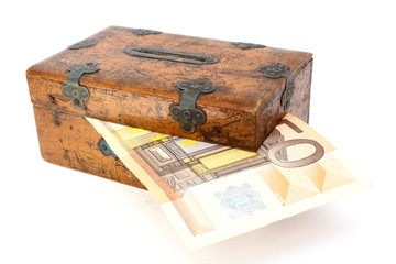 money partly in wooden box