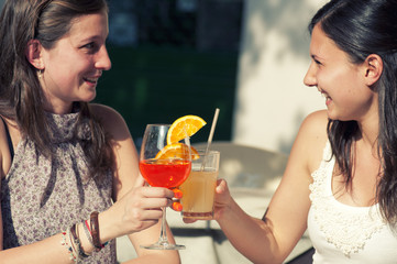 Two Girl While They Take a Cold Drink