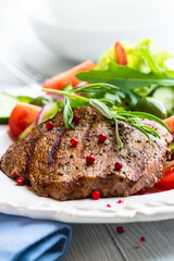 Grilled beef steak with fresh vegetables