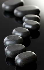 Spa stones on grey background