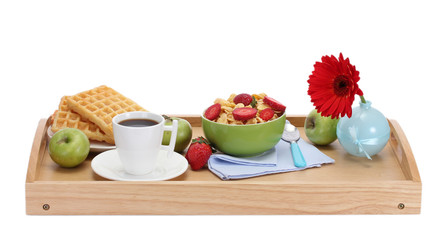 light breakfast on wooden tray isolated on white