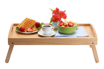 light breakfast on wooden tray isolated on white