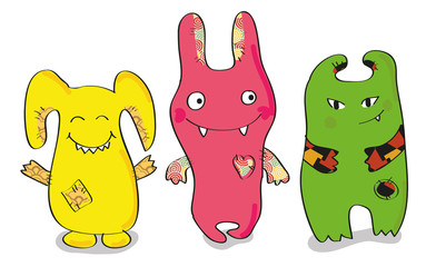 three happy-colored monsters