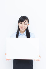 Fototapeta premium メッセージボードを持った女性