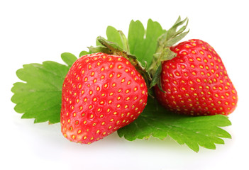 sweet ripe strawberries with leaves isolated on white