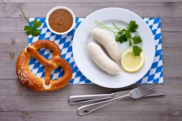 White sausages with sweet mustard and pretzel