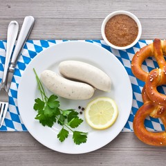 White sausages with sweet mustard and pretzel