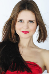 portrait bright beautiful girl with long hair in red