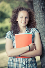 Young Beautiful Female Student at Park