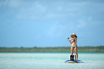 Fishing and paddleboarding in tropical destination