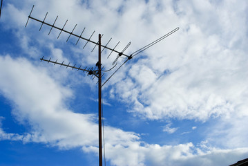 Home advance TV antenna on blue sky