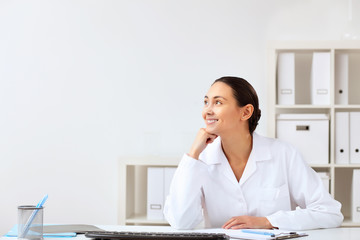 Young female doctor in white uniform