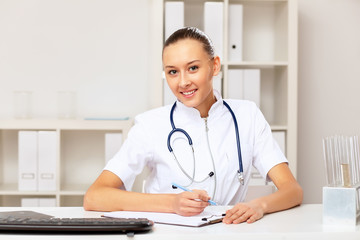 Young female doctor in white uniform