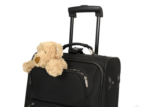 traveling: suitcase with teddy bear