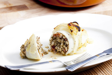 sepia filled with pearl barley baked with onion
