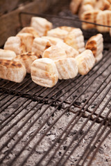 Traditional African 'roosterkoek' on metal grid