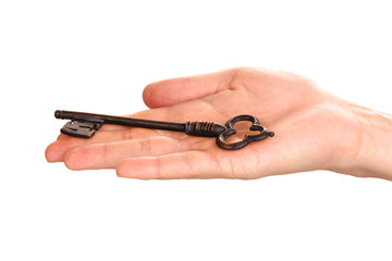 woman's hand holding an antique key on white background