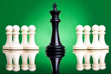 black king in front of white pawns