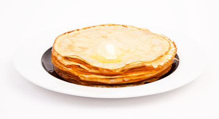 Crepes on white plate wit butter