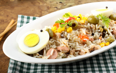 Rice salad with eggs, corn and olives