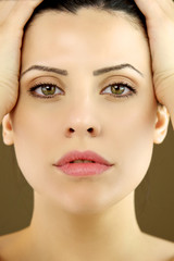 Fototapeta premium Portrait of beautiful female model with green eyes