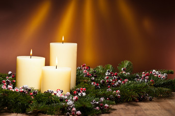 Three candles in an advent flower arrangement