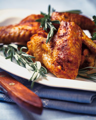 Chicken wings with rosemary sprigs