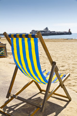 Single deck chair on the beach