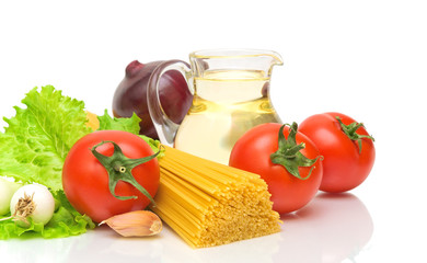 Pasta, vegetables and sunflower oil on a white background