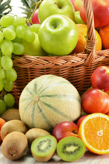 Composition with assorted fruits in wicker basket