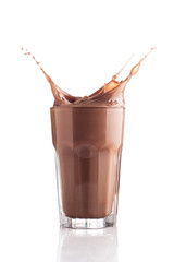 Chocolate splashing into glass