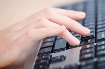 Hands typing on the keyboard