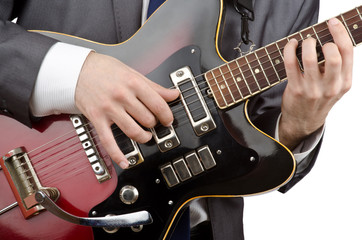 Businessman playing the guitar on white