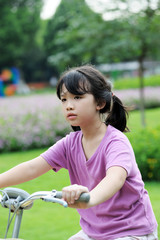 Asian kid riding bike