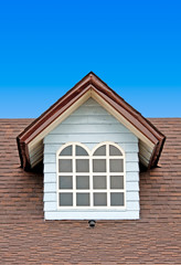 Brown roof on blue sky