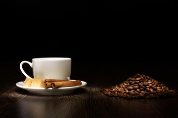 Coffee beans and white cup