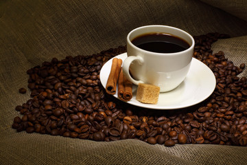 Coffee beans and white cup