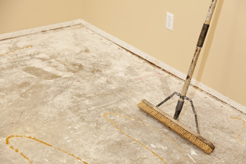 Concrete House Floor with Broom Ready for Flooring Installation