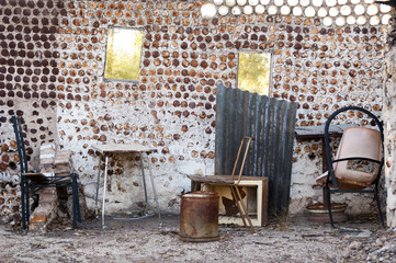 Interior of an old home built from tin cans with old furniture in Lightning Ridge in outback Australia