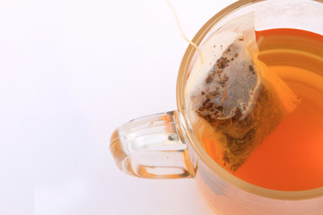 Cup of green tea isolated on white .