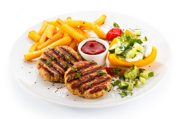 Grilled steak, French fries and vegetables