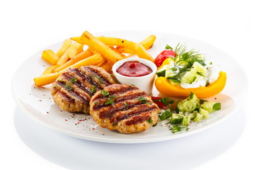 Grilled steak, French fries and vegetables